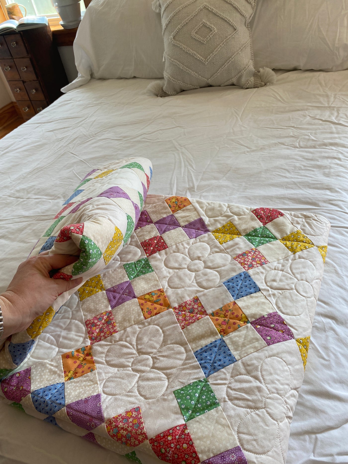 A colorful 1930s folding of the quilt. It is a heavy, premium weight cotton batting. 