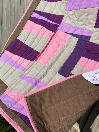 Modern, Heirloom, handmade, patchwork, baby size 27"x30",brown, pink, beige, purple, 100% cotton fabric, cotton polyester batting, straight line top quilting, embroidered tag, quilt